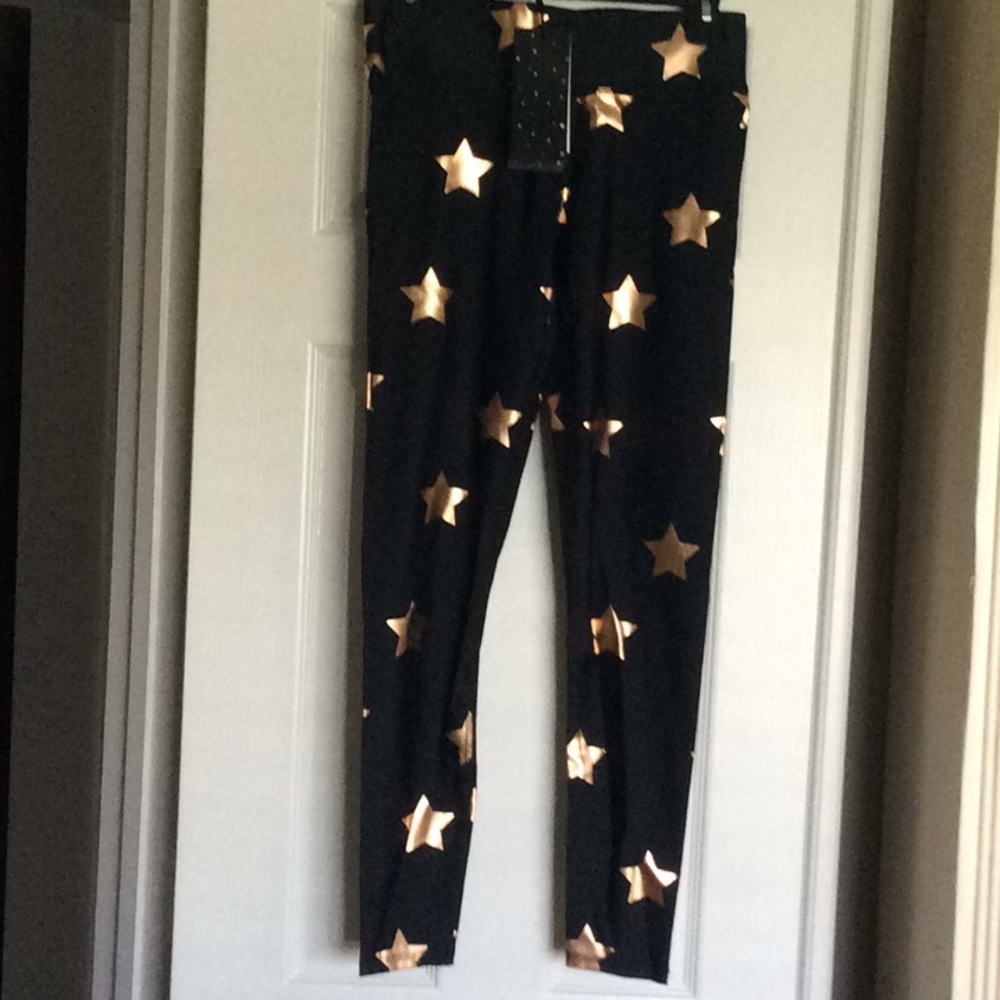 Terez black leggings with gold stars. NWT.